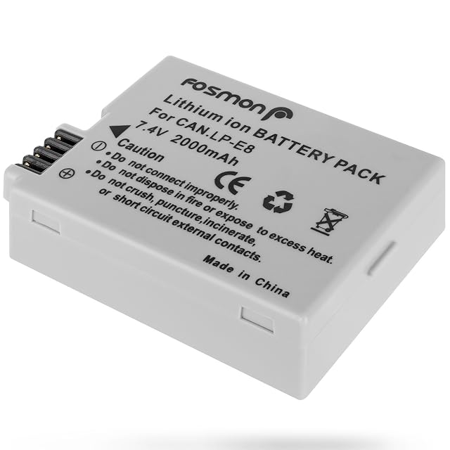 Fosmon LP-E8 replacement battery beside a Canon reflex body