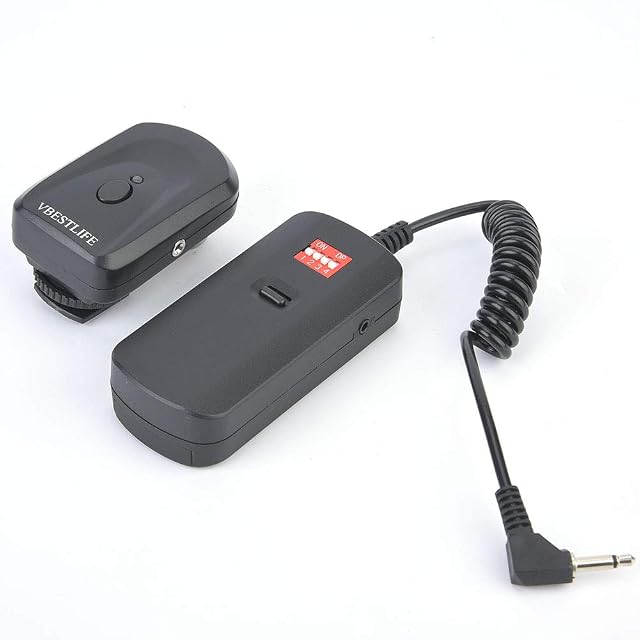 VBESTLIFE flash trigger transmitter and receiver pair in black with a sync adapter