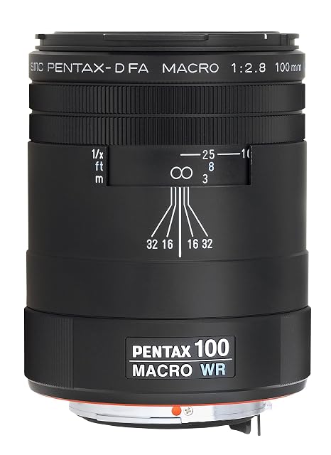 Pentax D FA 100mm WR macro lens in black with an aluminium barrel and its hood beside it