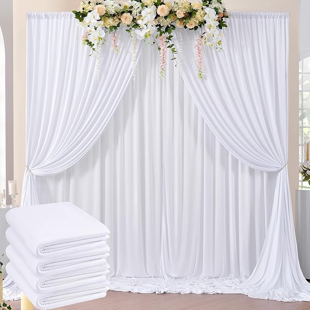 Htper white backdrop panels draped over a crossbar as a wide curtain