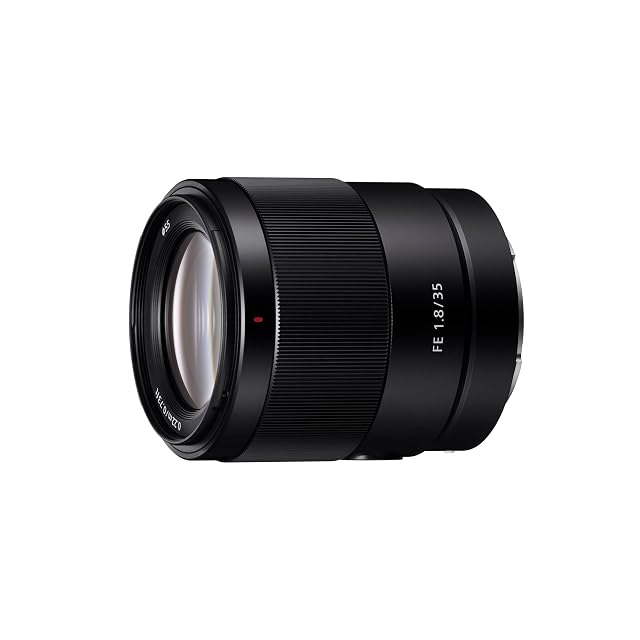 Sony SEL35F18F wide normal prime in black with its focus hold button and focus mode switch
