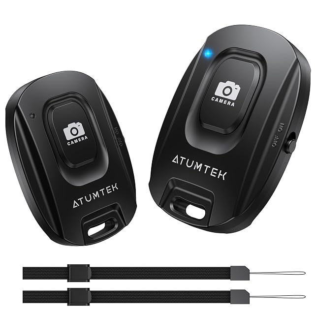 Pair of ATUMTEK Bluetooth camera remotes with a wrist strap attached